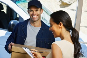 Courier Delivering Parcel to Woman