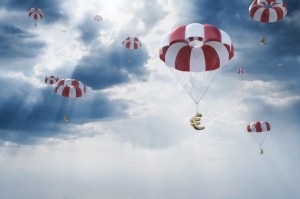 Parachutes with euro sign falling from sky